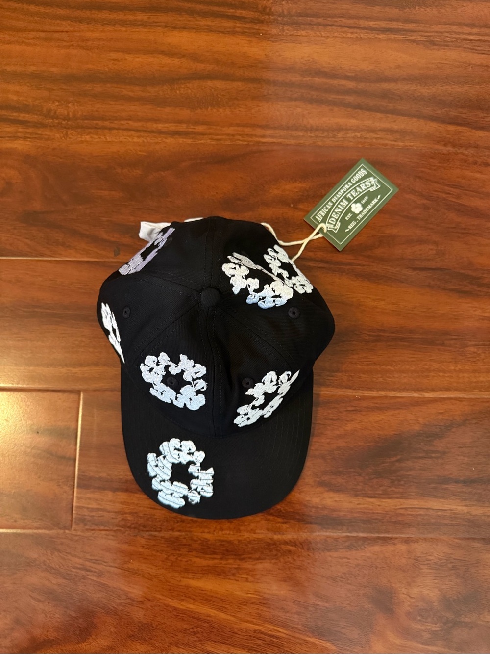 Black Baseball Cap with White Floral Appliqué